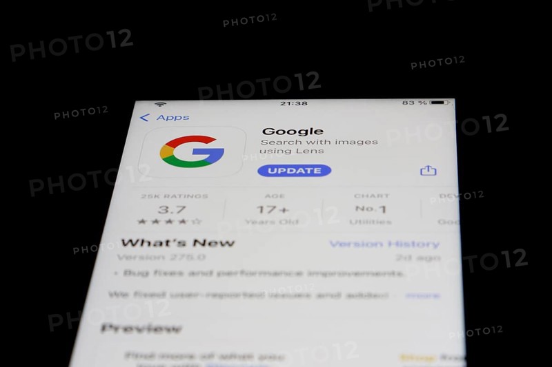 Detailed view of a smartphone with Google App in the iPhone App Store
