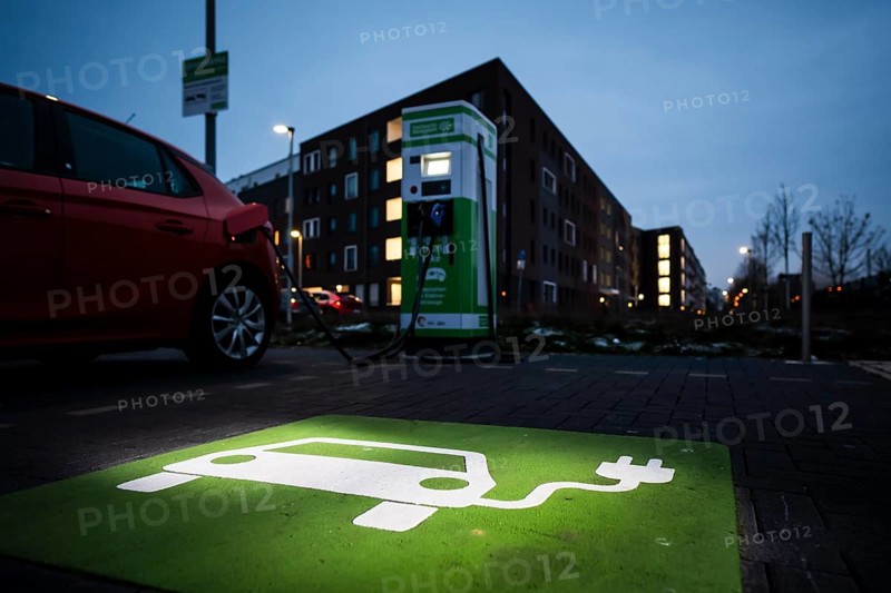 An e-car charges at a public charging station in Duesseldorf