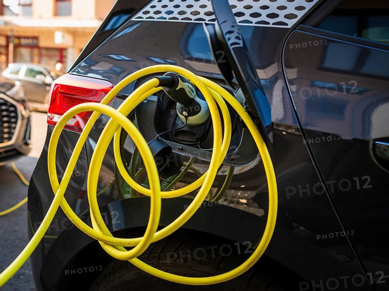 An e-car charges at a public charging station in Duesseldorf