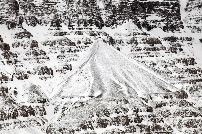 Snow covered talus cone and scree