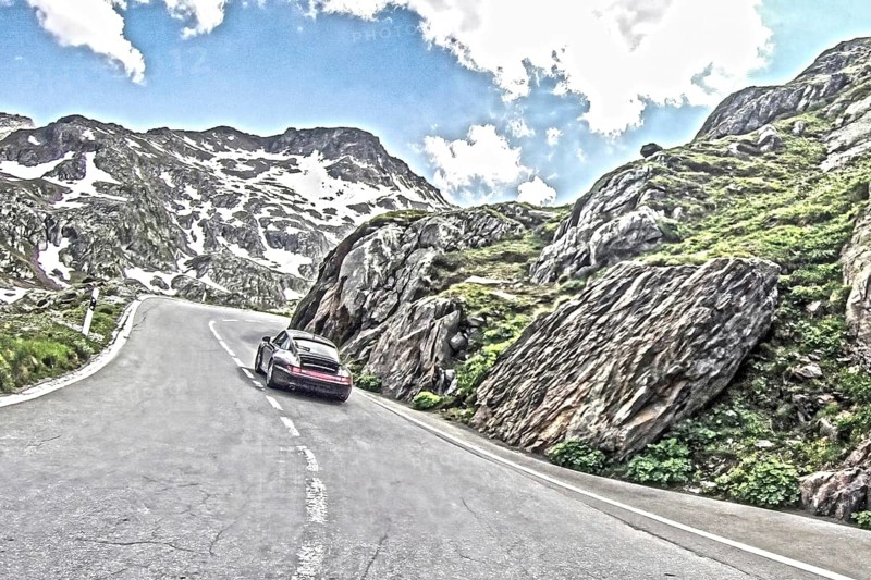 Photo with reduced dynamic saturation HDR of mountain pass alpine mountain road alpine road pass road pass Furkapass with serpentines