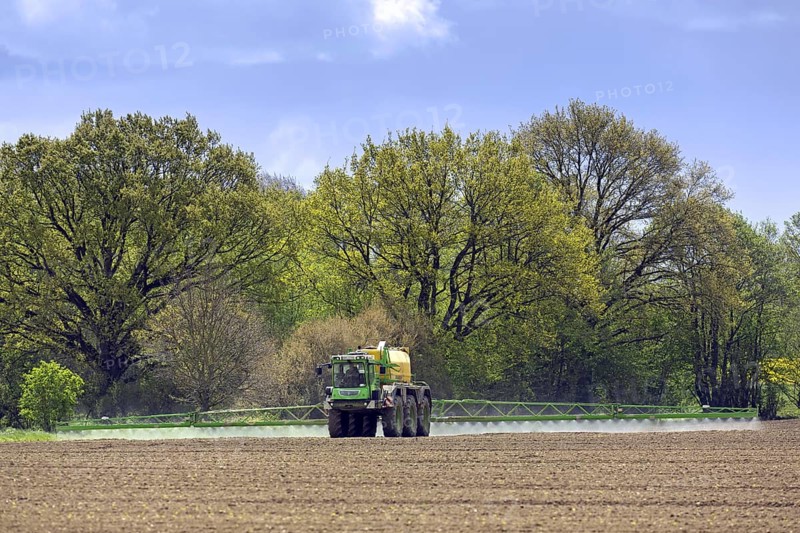 Farmer spraying pesticides