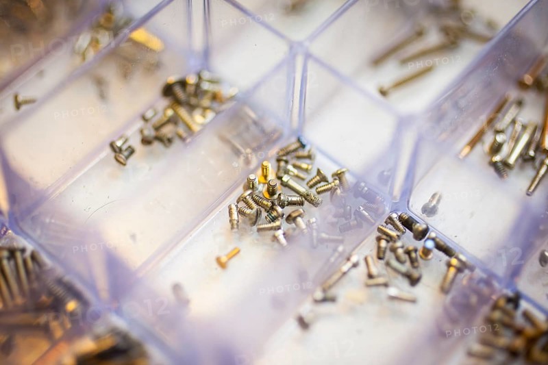 Screws for temples of glasses in a box at an optician's