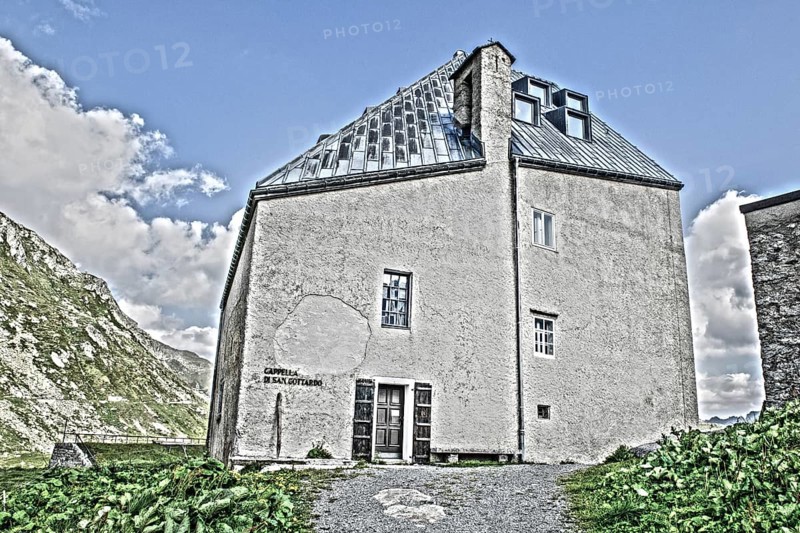 Photo with reduced dynamic range saturation HDR of view on historic hotel accommodation Ospizio San Gottardo Sankt Gotthard Hospiz with historic buildings from year 1237 13th century on 2091 meter high Gotthardpass