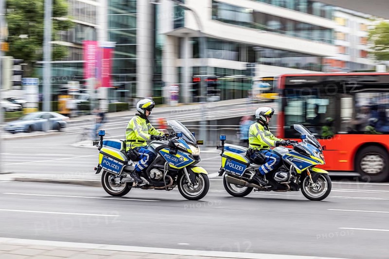 Police motorbike at night in front of urban environment