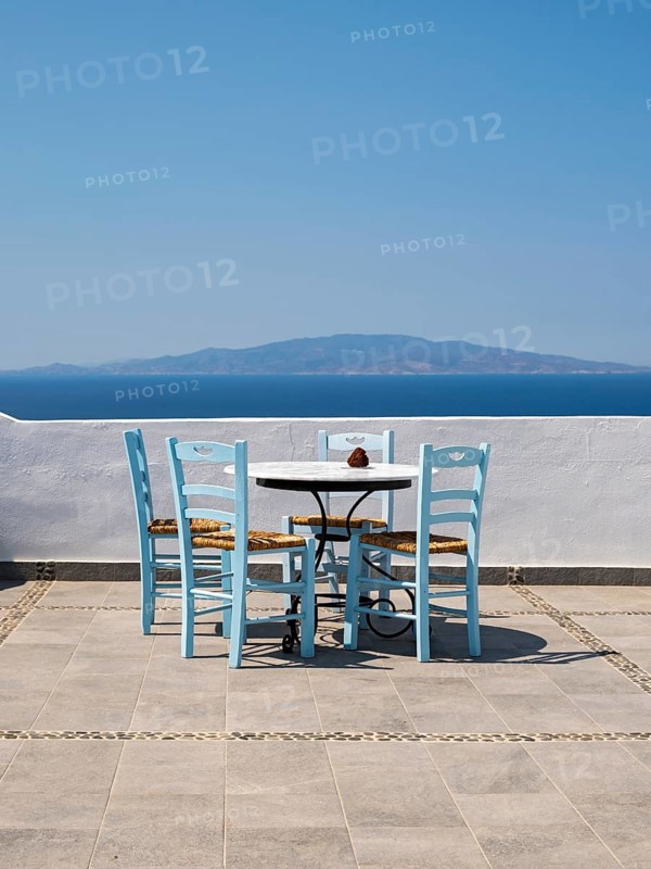 Sea view from terrace with chairs and table