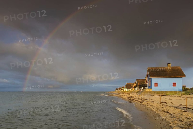 Rainbow and beach houses on the peninsula Graswarder