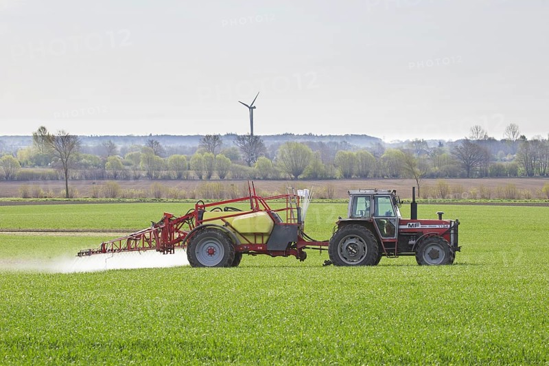 Farmer spraying pesticides