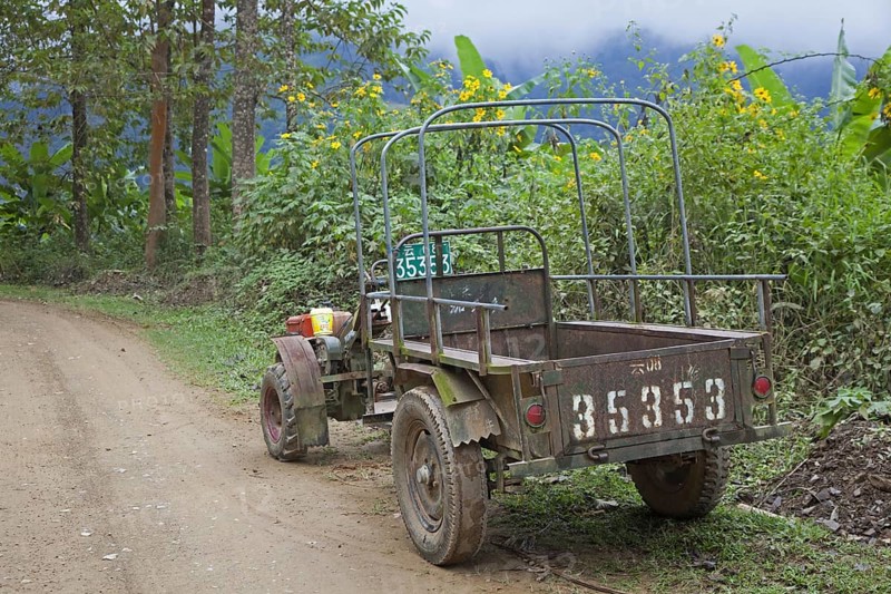 Typical Chinese two-wheel tractor with trailer in the Yunnan province