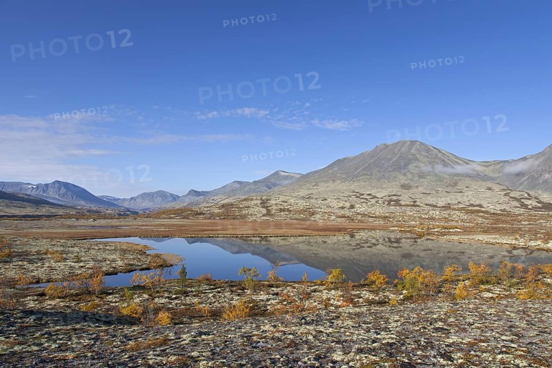 Lake in front of the mountain Stygghoin in autumn
