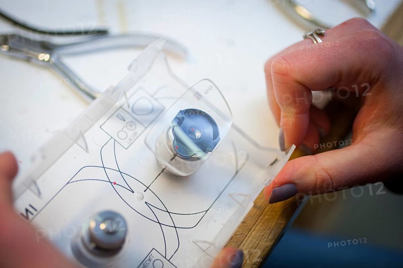 Fitting of a spectacle lens by an optician