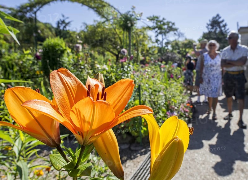 Elderly tourists visiting the garden at the home of Impressionist painter Claude Monet in Giverny