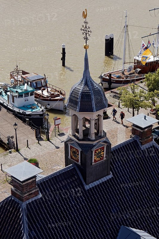 Ships in the museum harbour with the tower of the Alte Waage seen from the town hall tower