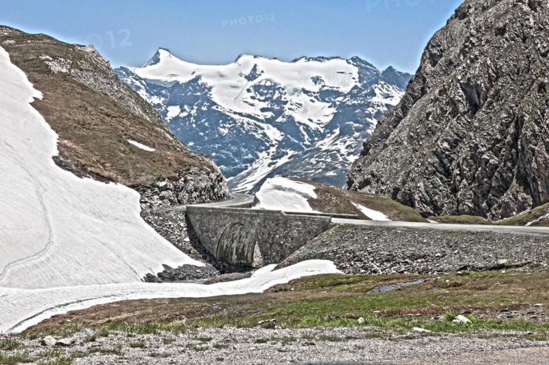 Photo with reduced dynamic saturation HDR of bridge stone bridge mountain pass alpine mountain road alpine road pass road pass Col de l'Iseran