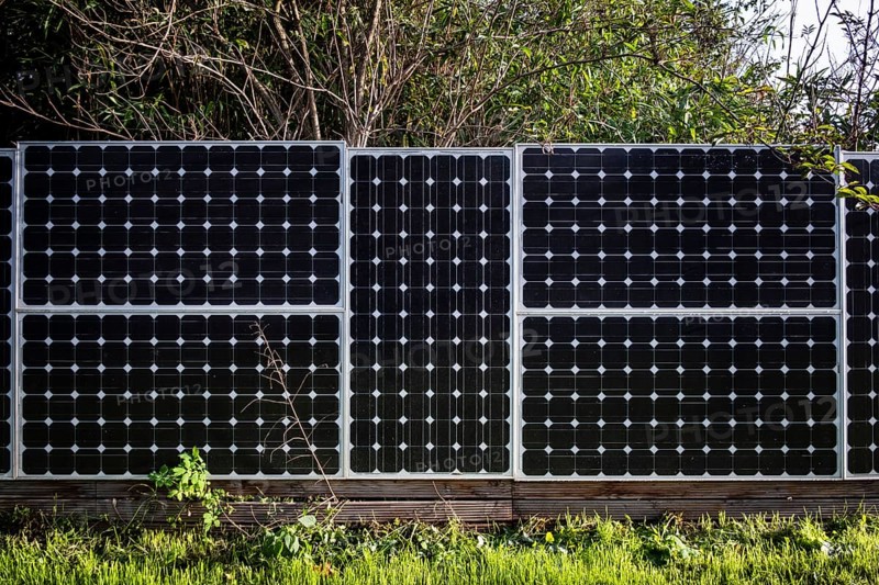 Solar panels as a garden fence and privacy screen of a house on a street in Langenfeld