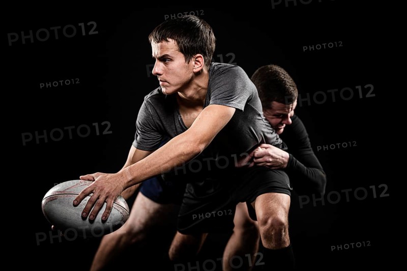 Front view male rugby players with ball