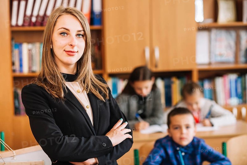 Female teacher blurred background classroom