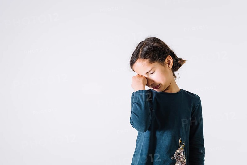 Girl wiping tears