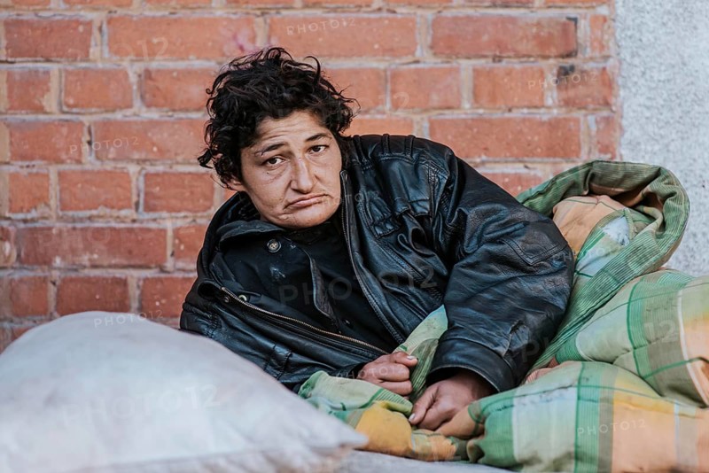 Homeless woman blanket outdoors