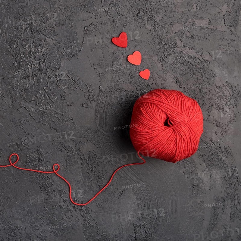 Red wool ball slate background