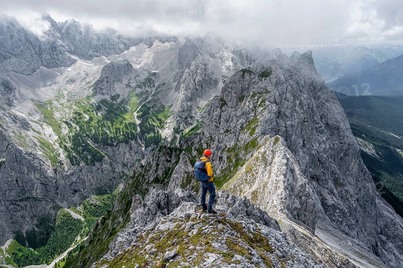 Mountaineer at the summit of the Waxenstein