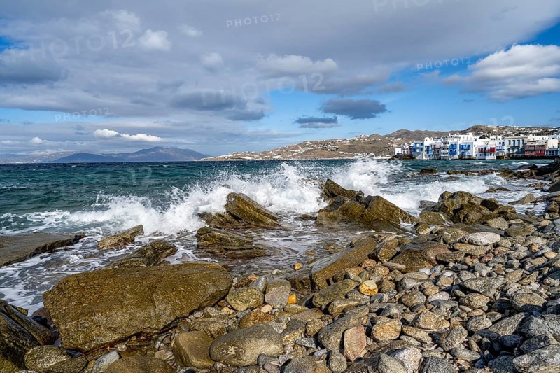 Waves breaking between the rocks on the beach