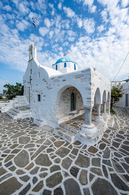 White Greek Orthodox Church Holy Church of Agios Konstantinos with Greek flag