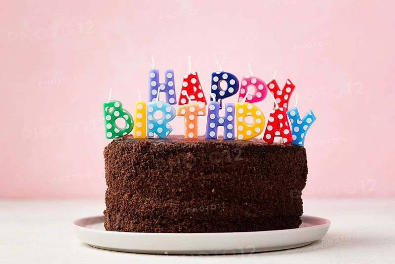 Birthday concept with chocolate cake cute candles