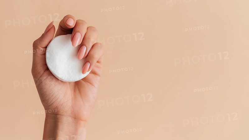 Healthy beautiful manicure with cotton pads copy space