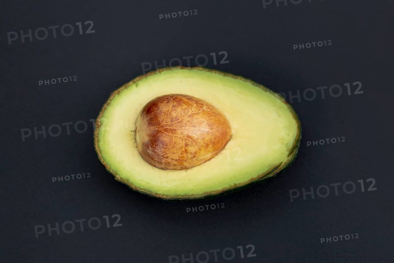 Top view avocado half with pit