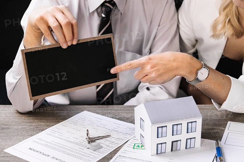 Real estate agent with client meeting