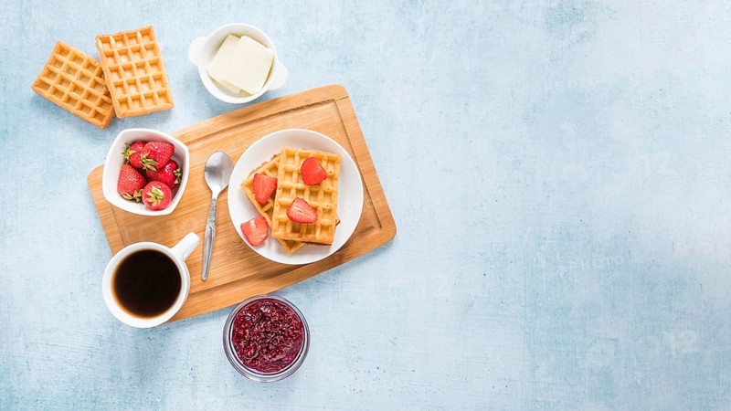 Board with waffles fruits with copy space