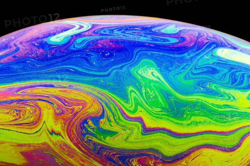 Gradient multicolored soap bubble black background