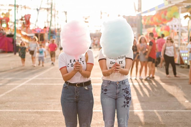 Happy friends having fun amusement park
