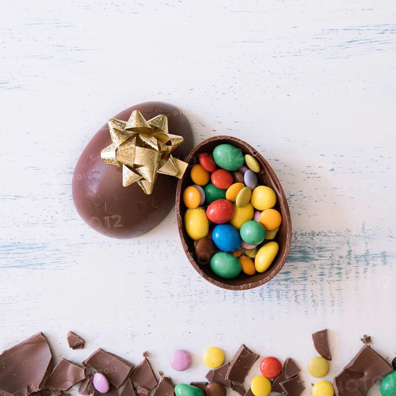 Close up egg with candies bow
