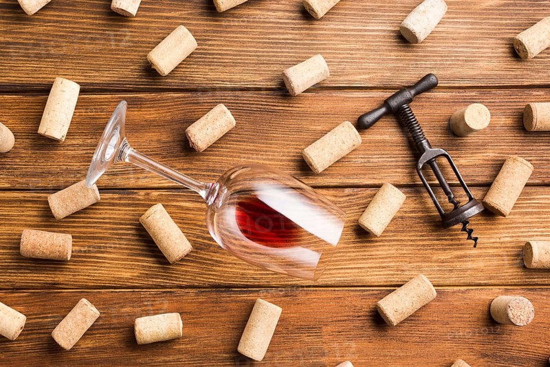 Wine accessories with corks background