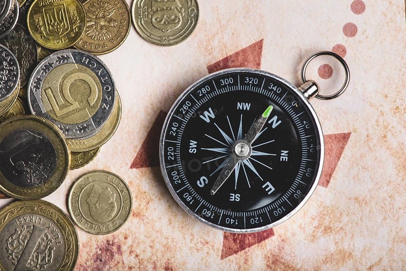 Close up coins compass