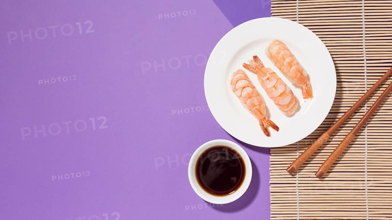Top view delicious sushi with soy sauce table