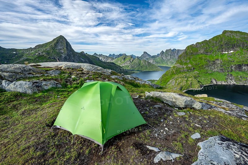 Green tent in the mountains