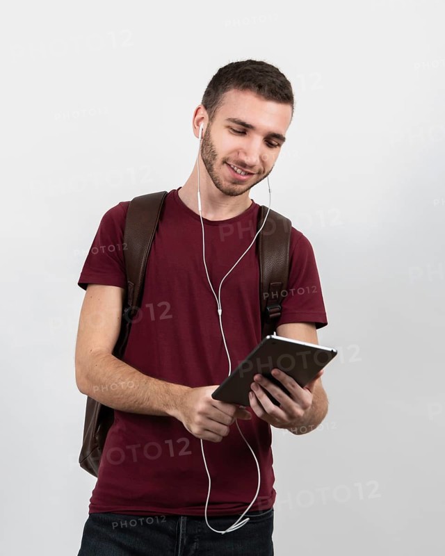 Guy listening music tablet