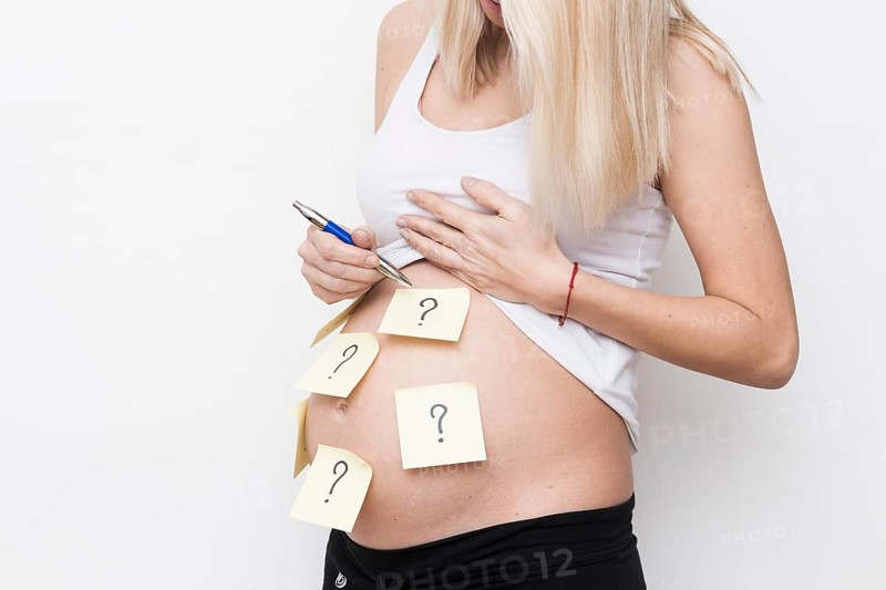 Pregnant woman with sticky notes