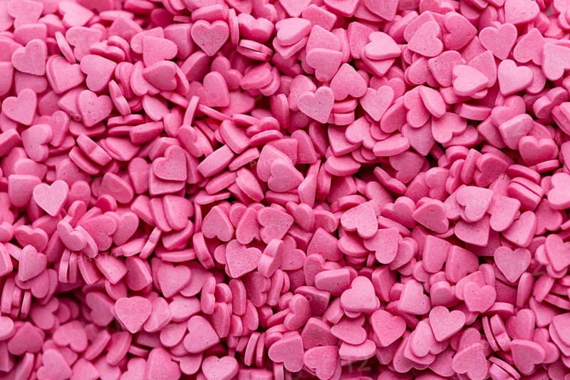 Top view heart shaped pink sweets