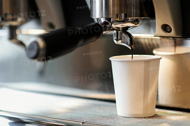 Machine pouring coffee disposable cup