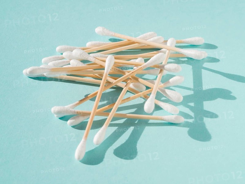 Arrangement with cotton buds blue background