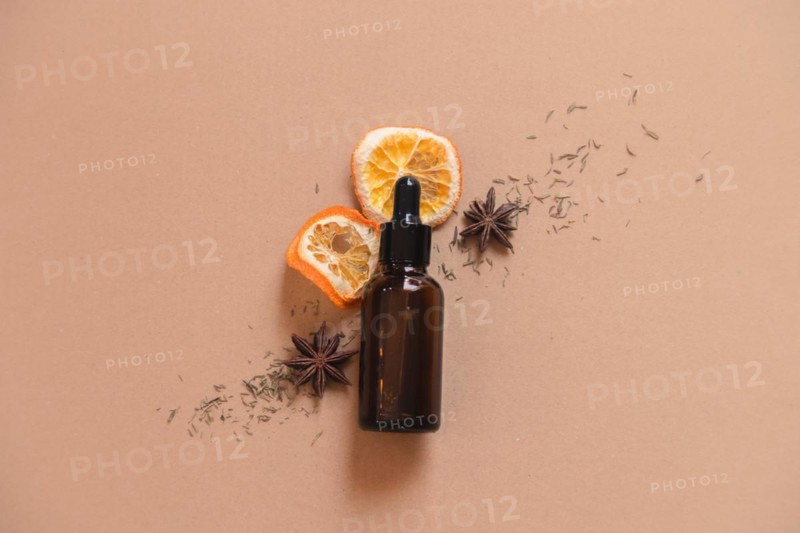 Glass bottle dropper containing organic all natural skincare serum for product mock up