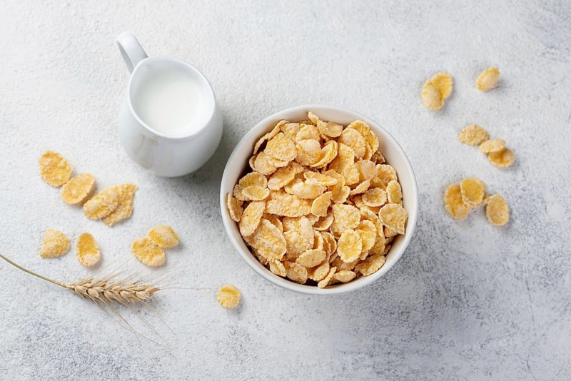 Top view corn flakes breakfast with milk wheat