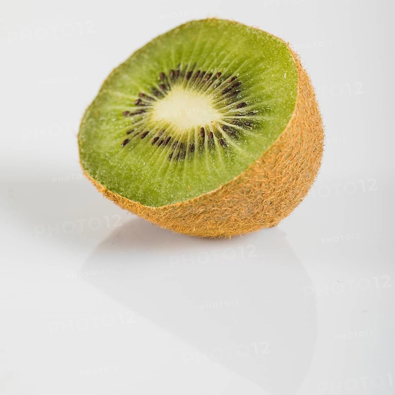 Close up fresh kiwi fruits white surface