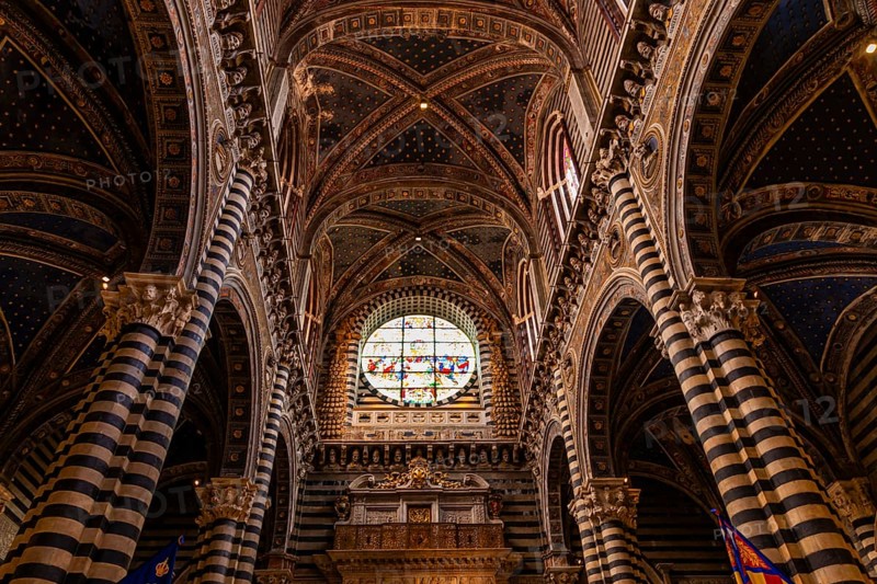 The nave of the cathedral with its black and white striped marble columns