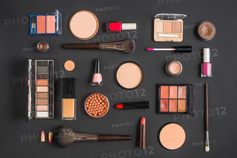Different type makeup products black backdrop