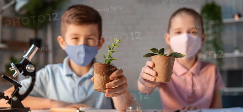 Medium shot kids holding plant pots